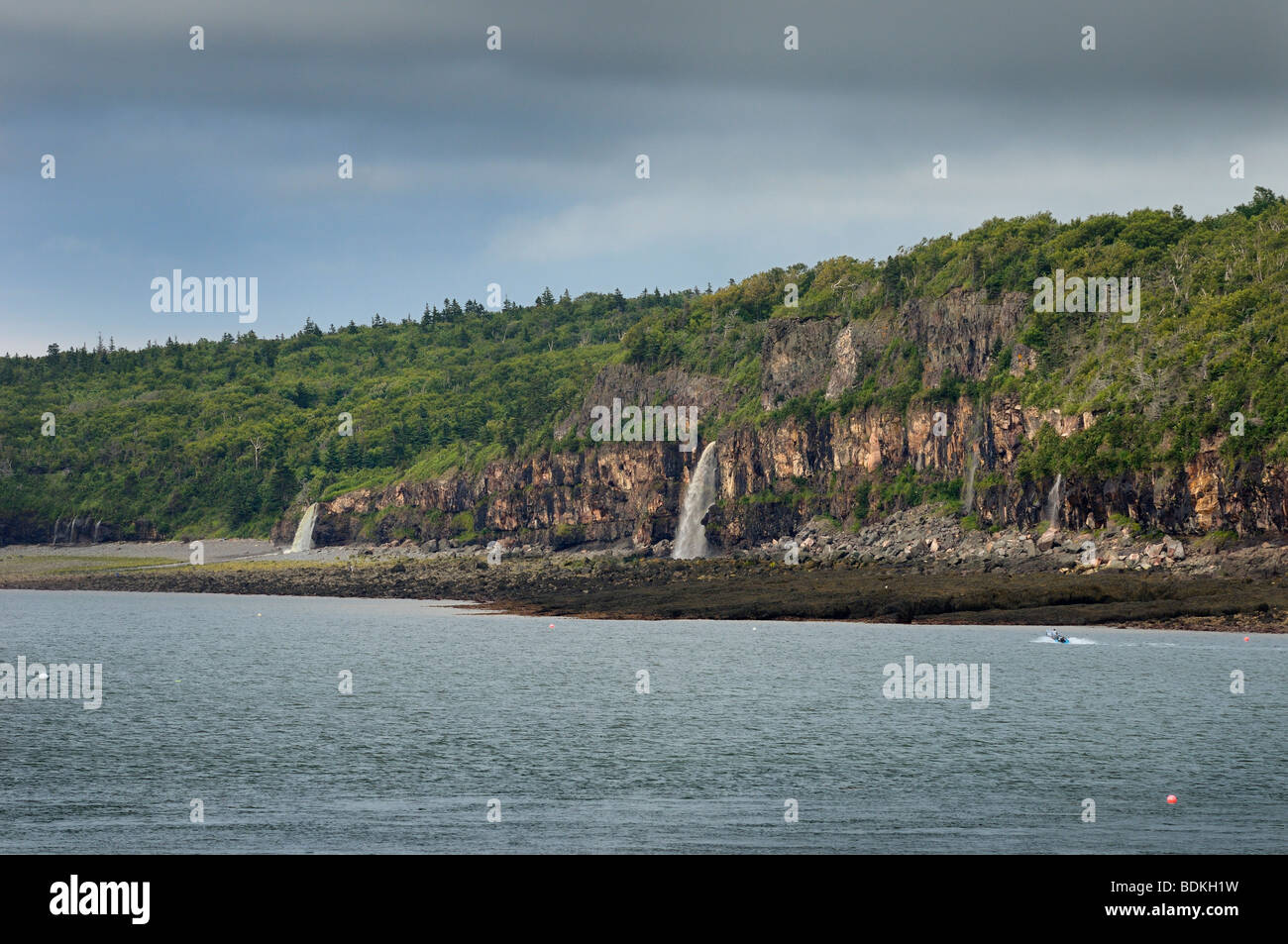 Waterfalls pouring into the Bay of Fundy from the north shore at Digby Gut Nova Scotia Stock Photo