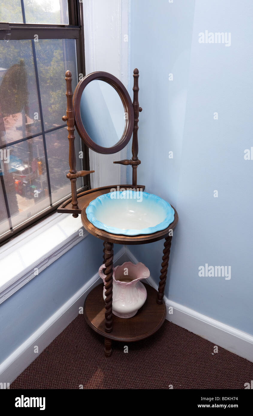 An antique washstand in a corner, Philadelphia, PA, USA. Stock Photo