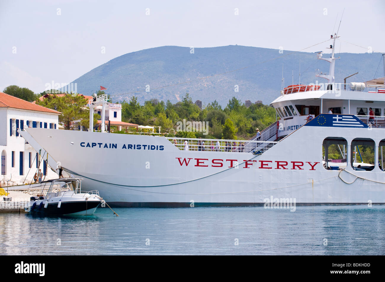 Passenger and car ferry disembarking in harbour at Fiskardo on the Greek Mediterranean island of Kefalonia Greece GR Stock Photo