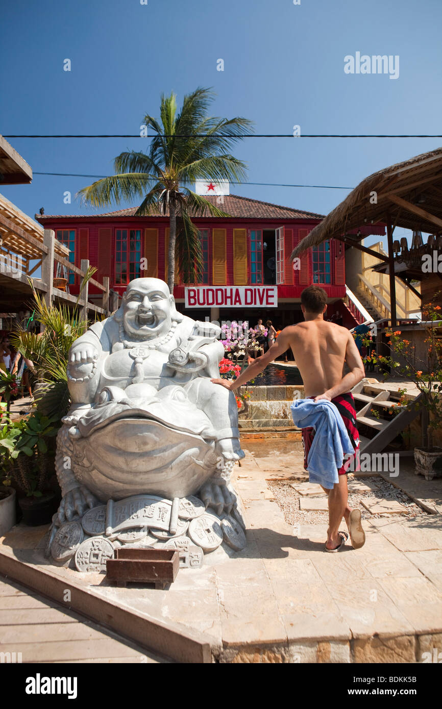 Indonesia, Lombok, Gili Trawangan, beach road, large silver Buddha figure outside scuba dive shop Stock Photo