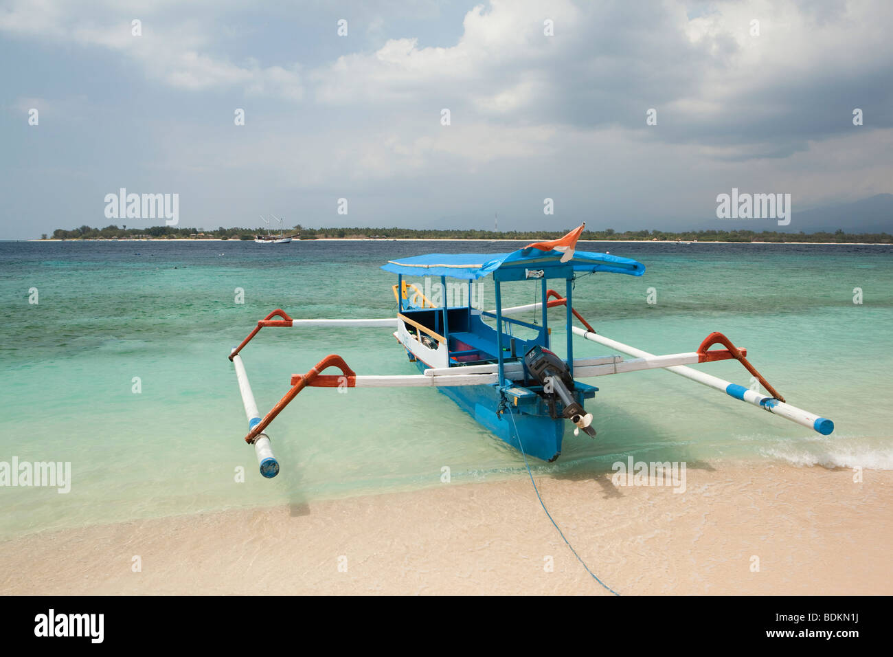 Indonesia, Lombok, Gili Trawangan, beach, outrigger boat opposite Gili Meno island Stock Photo