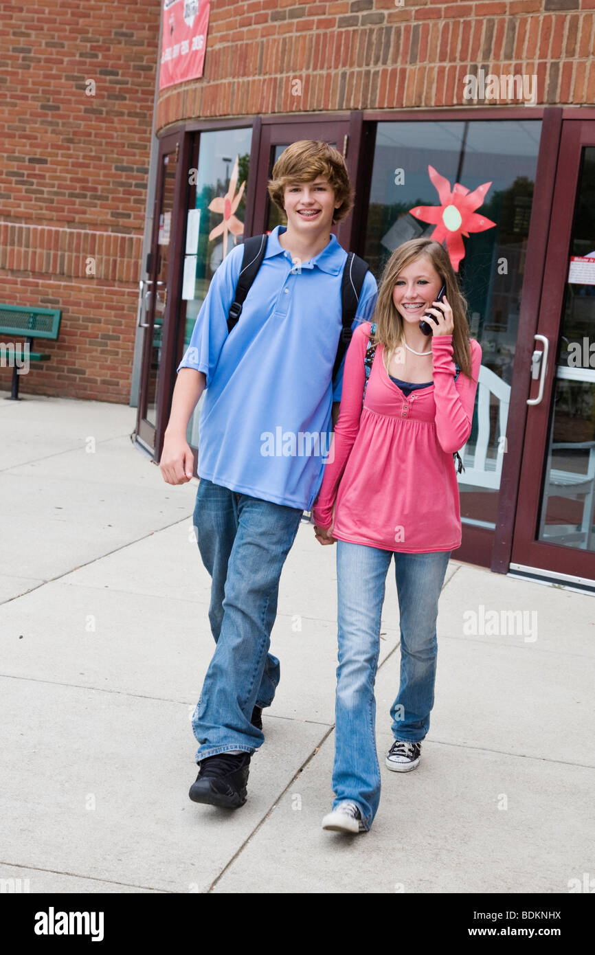 Teenage Boy And Girl Holding Hands