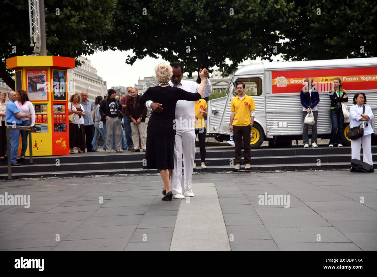 Glamorous mixed race elderly couple dancing in the foyer at The Royal Festival hall South Bank London Stock Photo