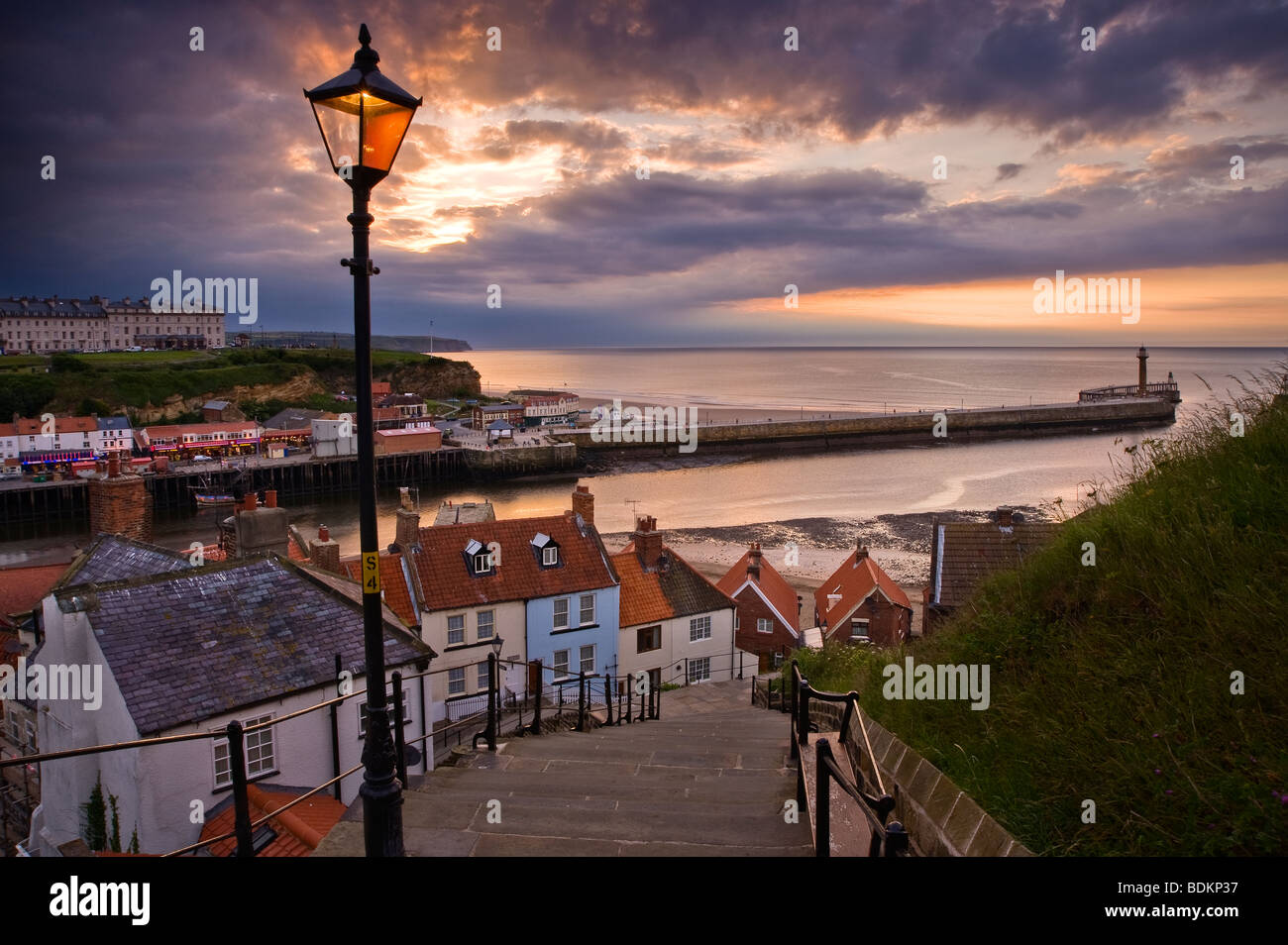 Mid summer sunset over the 199 steps Whitby Stock Photo