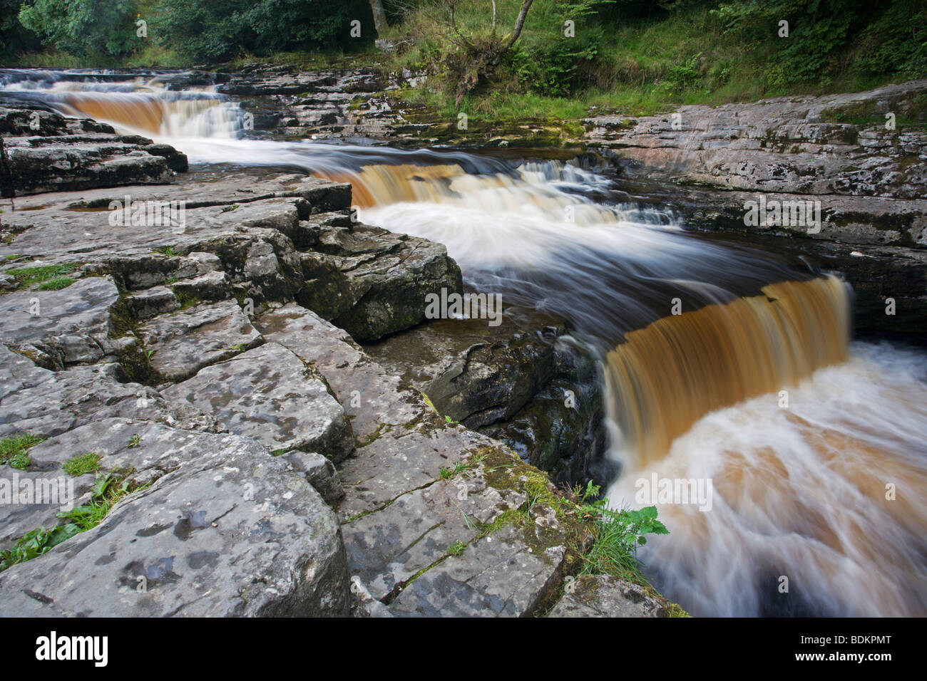 Series of stepped falls or rapids at Stainforth Force Waterfall on the