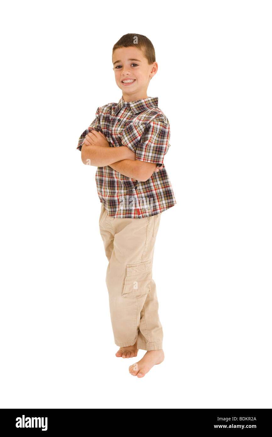 Young caucasian boy dressed in a casual outfit and standing on a white background. Stock Photo