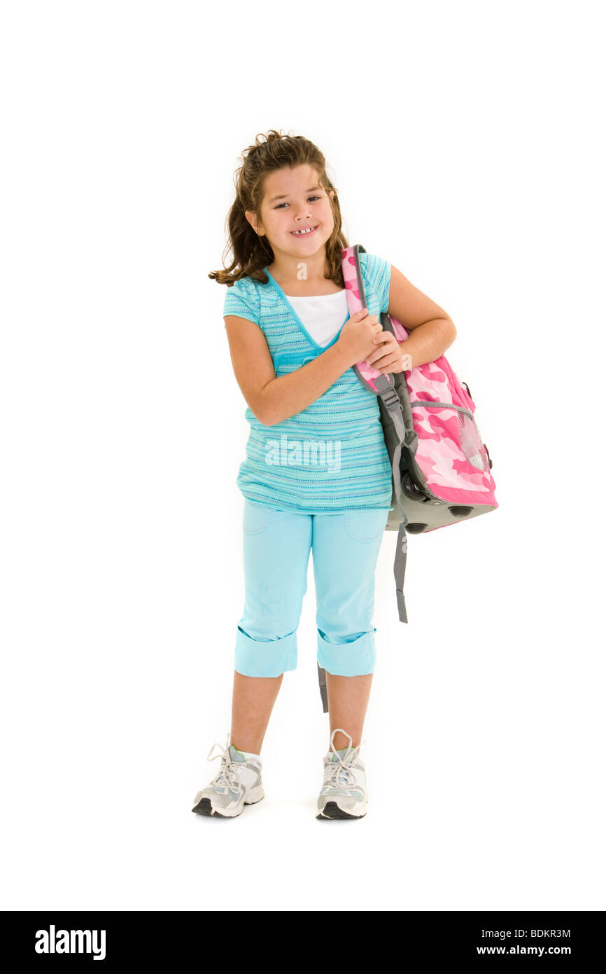 Child holding a school backpack and standing on a white background Stock Photo
