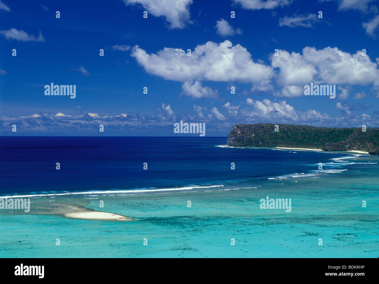 Tumon Bay with sandy islet and reef, Two Lovers Point in distance; Guam, Micronesia. Stock Photo