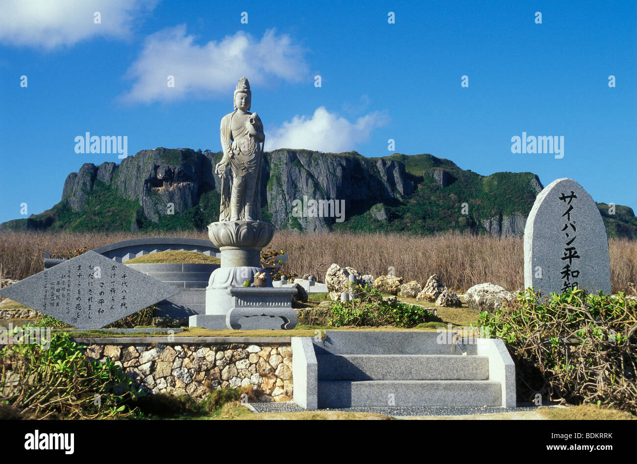 Japanese memorial Heiwa Kannon, the Peaceful Goddess of Mercy, with Suicide Cliff in distance; island of Saipan. Stock Photo