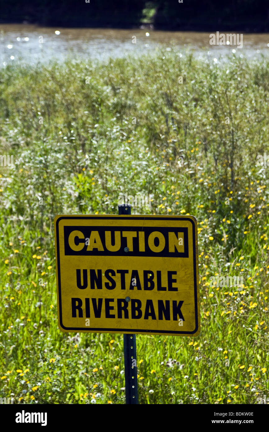 caution unstable riverbank sign Winnipeg Manitoba Canada Stock Photo