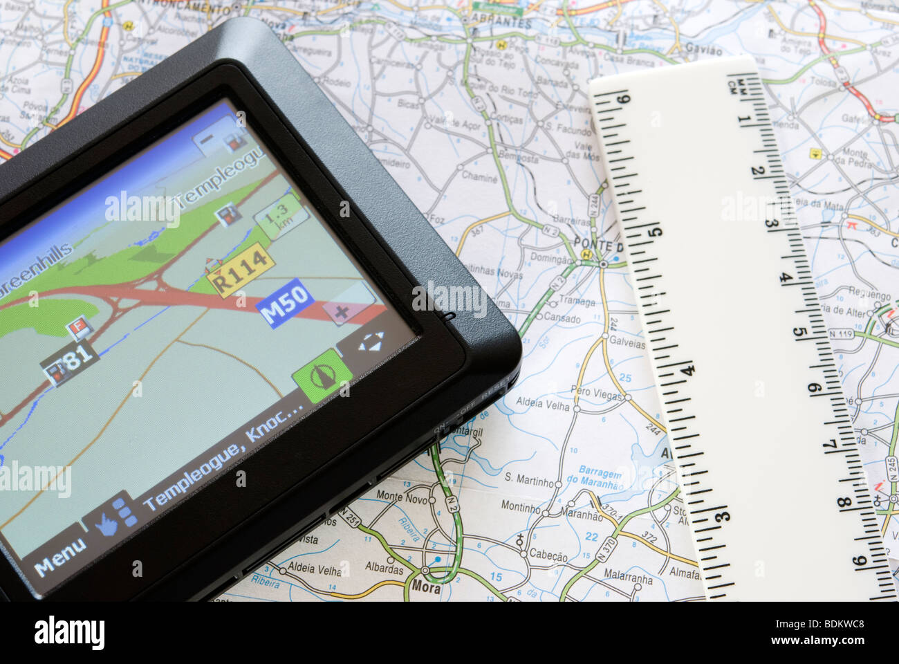 GPS global positioning system device arranged with map Stock Photo - Alamy