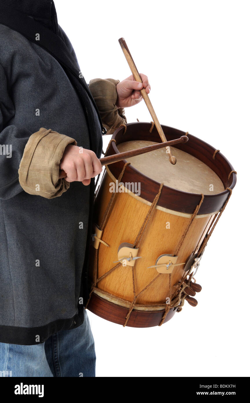 Drummer boy playing isolated over a white background Stock Photo