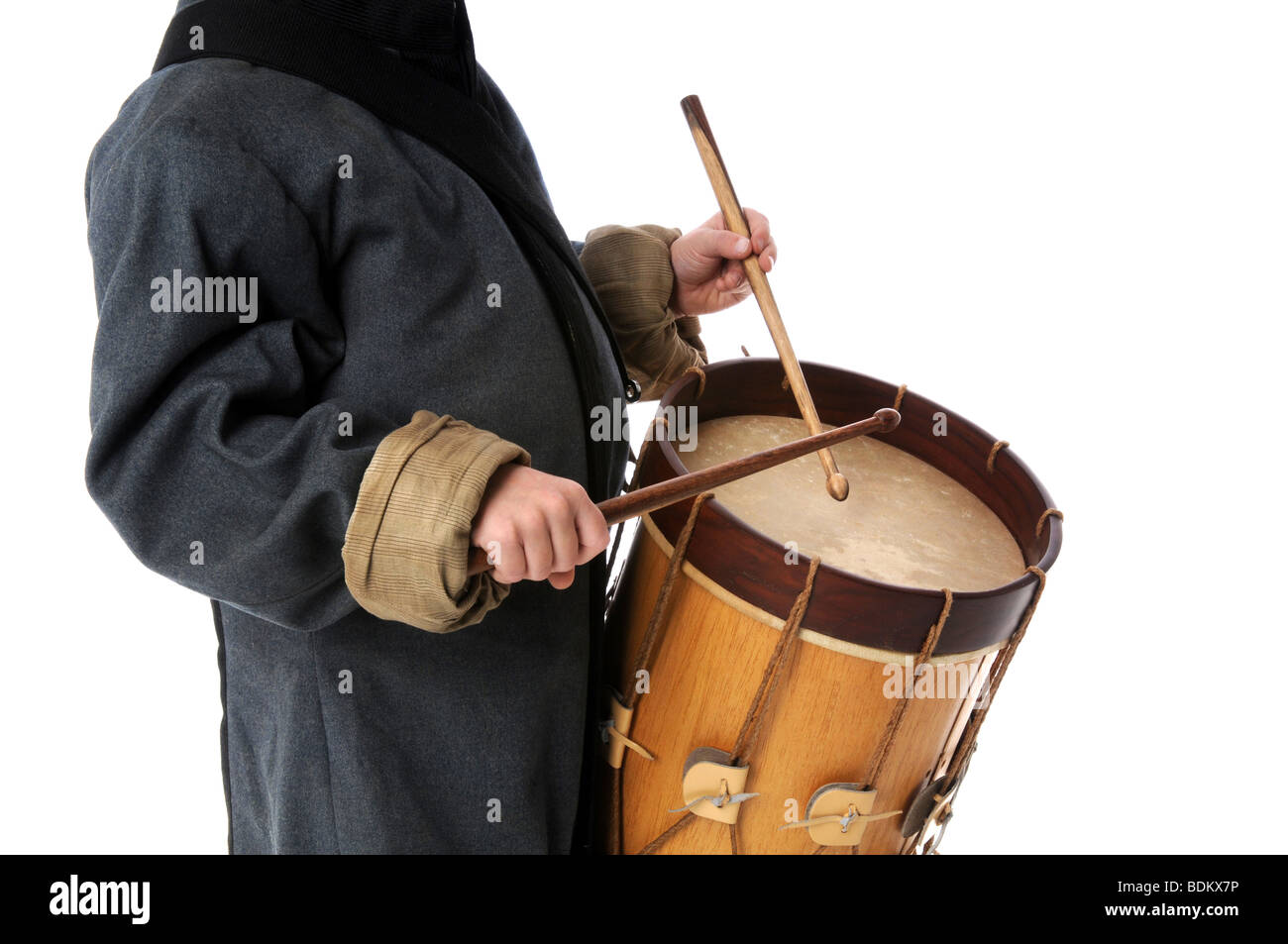 Drummer boy playing over a white background Stock Photo