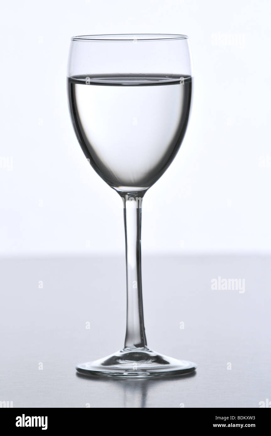 Glass of white wine isolated on a neutral background Stock Photo Alamy