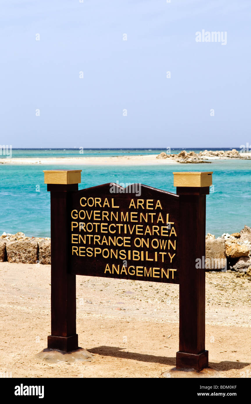 Sign 'Coral Area' on tropical beach Stock Photo