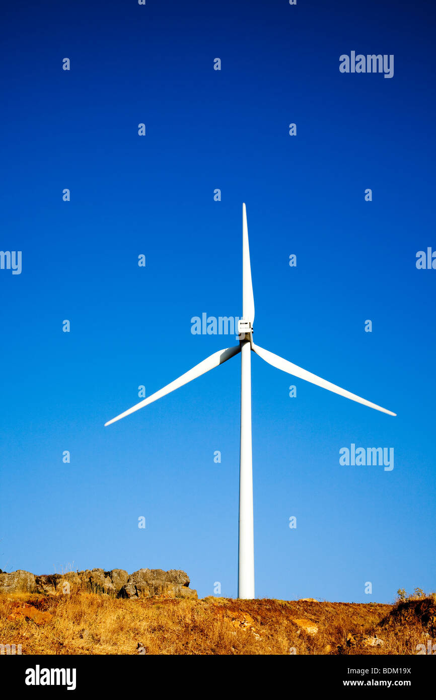 Wind generator against a blue sky Stock Photo