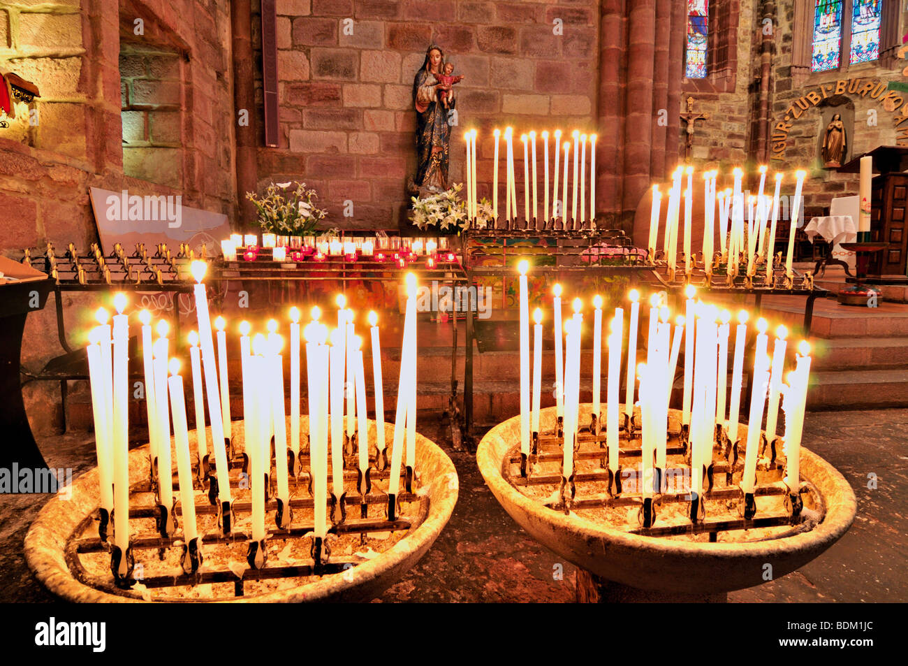 France, St. James Way: Candle lights in the parish church Notre Dame in St. Jean-Pied-de-Port Stock Photo
