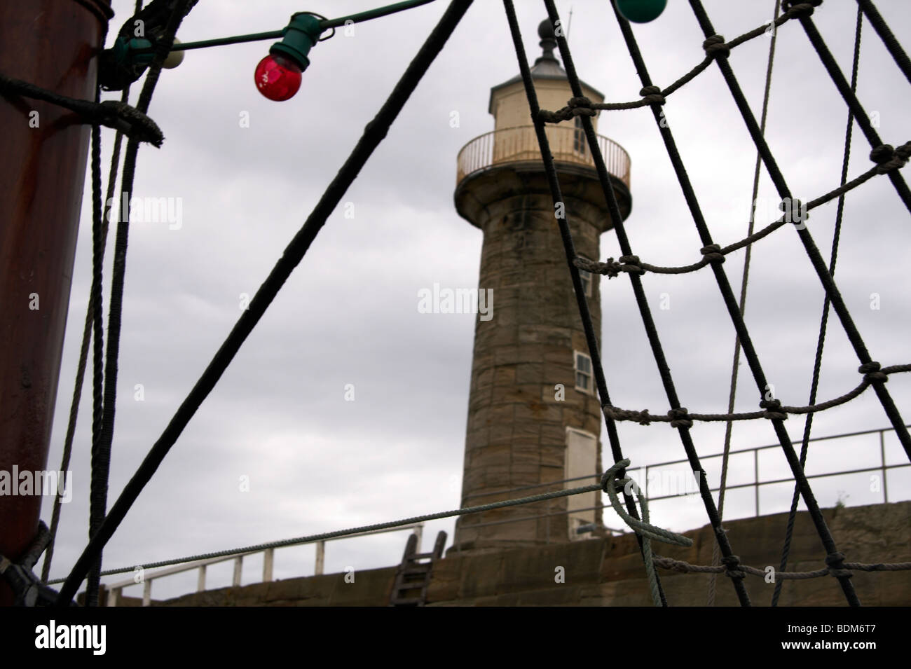 Tall ship rigging, sailing past West Pier Lighthouse, Whitby Harbour ...