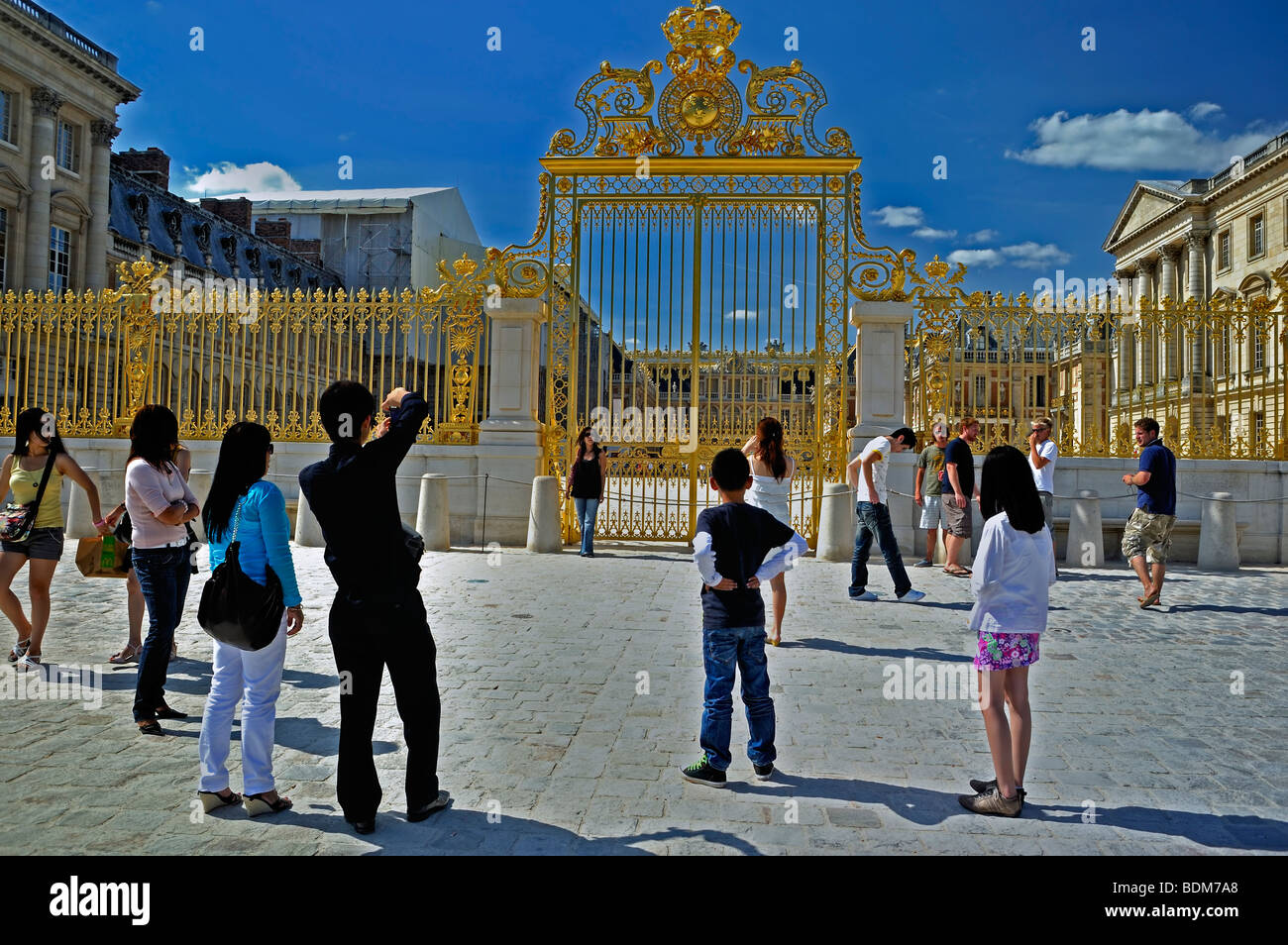 Versailles- Asian Family Tourists Visiting French Monument, Chateau de Versailles, Man Taking Photos in front Palace of Versailles France, Stock Photo