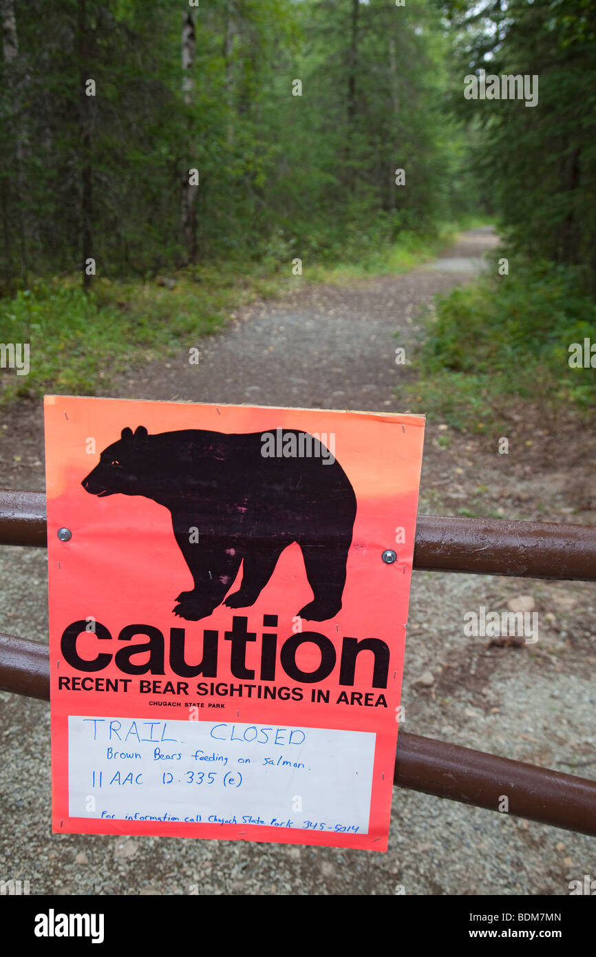 Eagle River, Alaska - A sign warns that a trail in Chugach State Park is closed due to danger from brown bears. Stock Photo