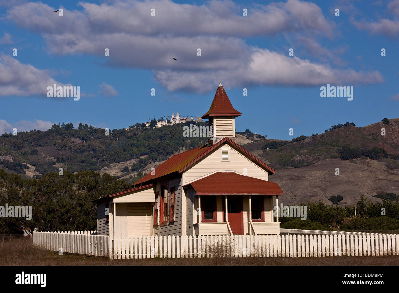 An old abandoned school house sits below Hearst Castle in the small enclave of San Simeon, California, USA. Stock Photo