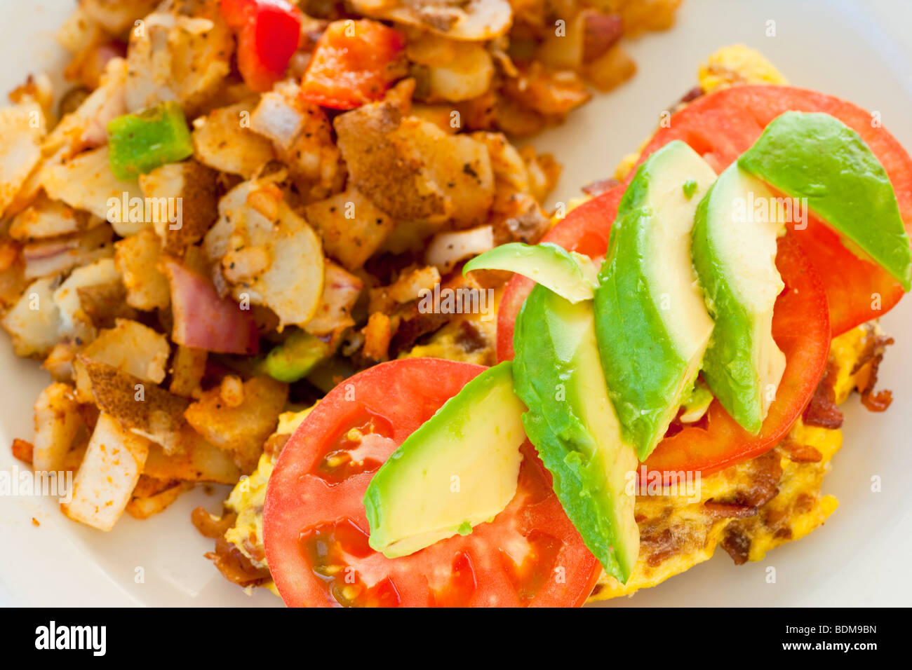 bacon omelette with avocado and tomatoes and hash brown potatoes, Danny