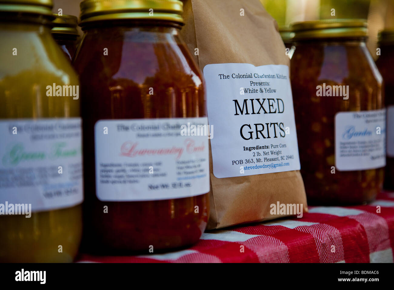 Stone ground grits and other local delicacies at the organic local produce farmers market in Marion Square in Charleston, SC Stock Photo