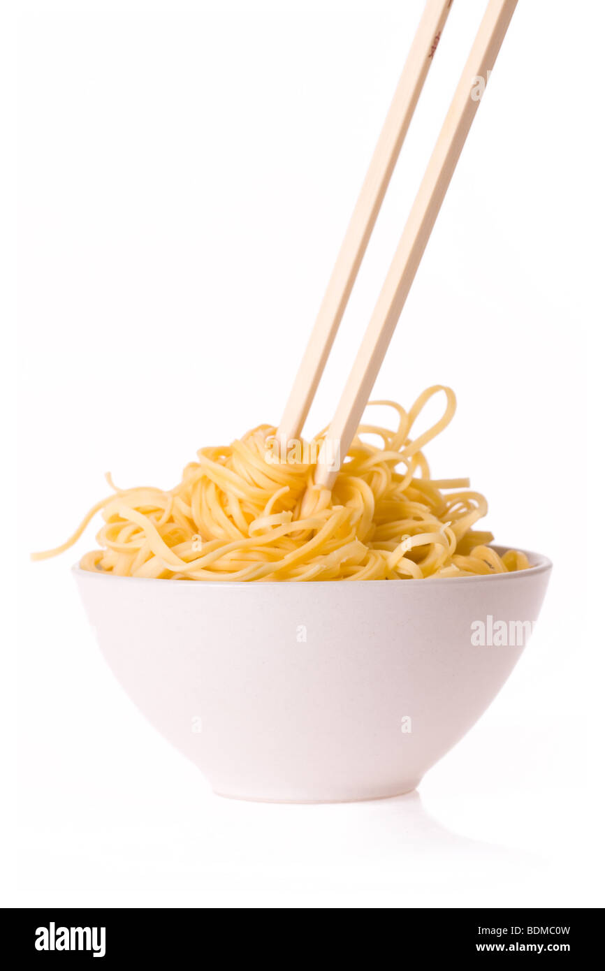 chopsticks,bowl and noodles on white background Stock Photo