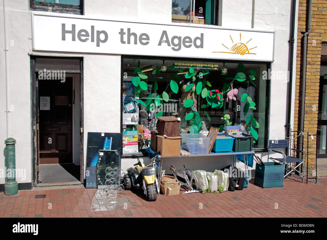 The Help the Aged charity shop on the High Street, Egham, Surrey, UK. Stock Photo