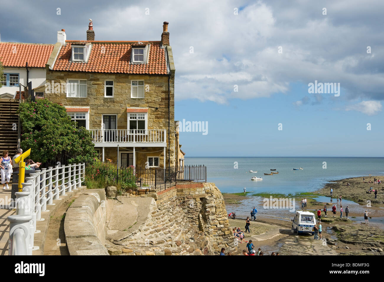 Cottages houses homes on the seafront in summer Robin Hoods Bay North