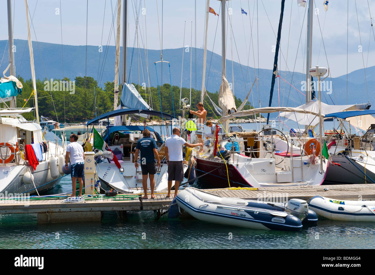 Sailing yachts moored in marina at Fiskardo on the Greek Mediterranean island of Kefalonia Greece GR Stock Photo