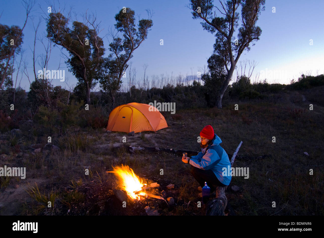 Woman by campsite, Blue Mountains National Park, New South Wales, Australia Stock Photo