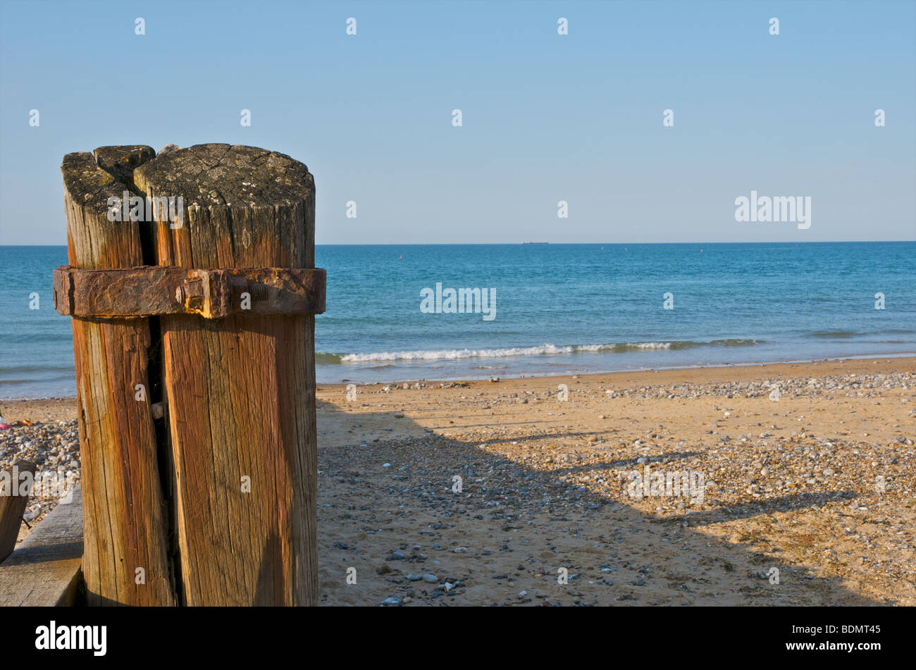 A wooden beach groin on the sandy beach at Cromer, Norfolk. Stock Photo
