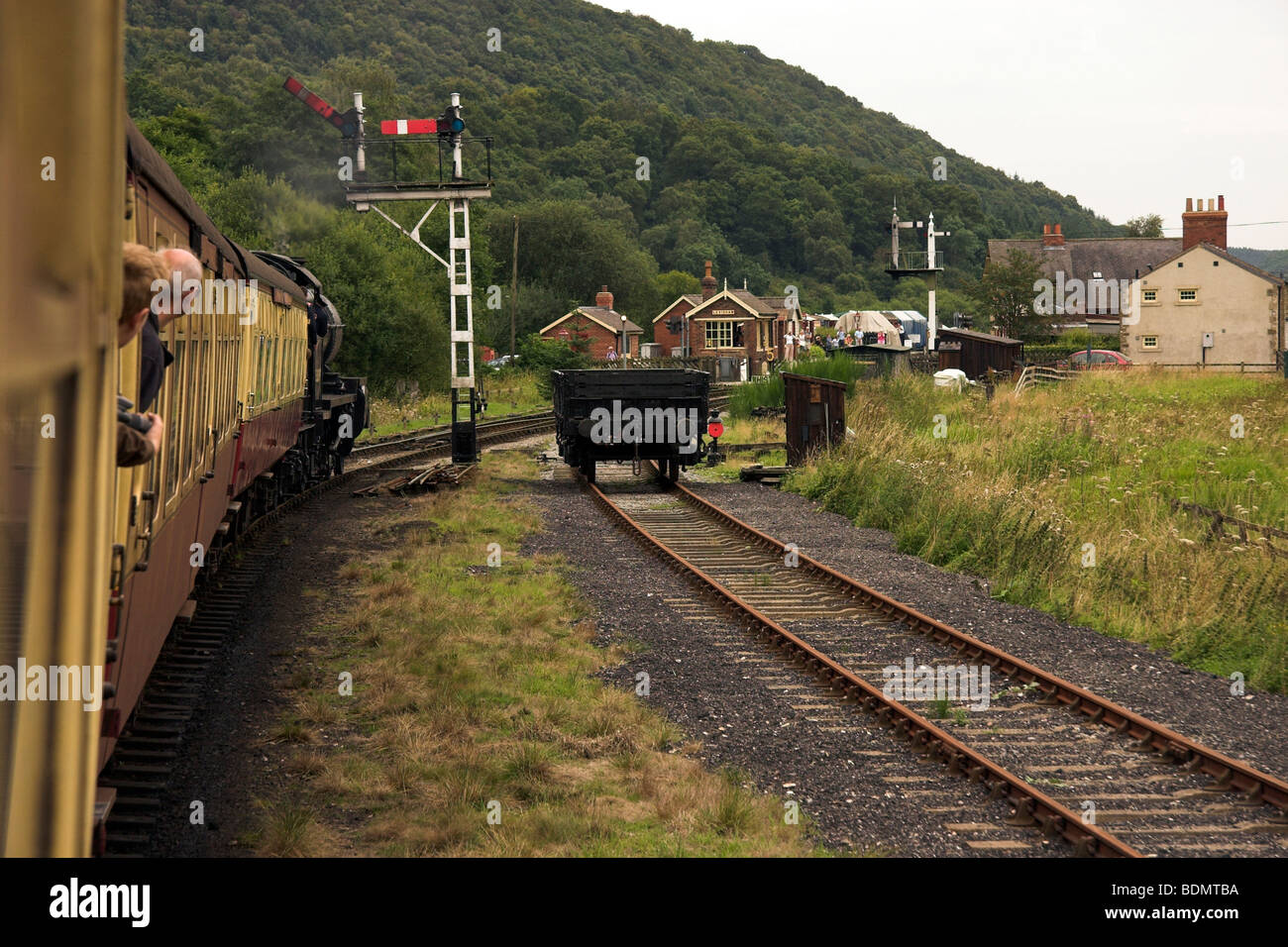 NYMR, Passengers leaning out of the window of a moving steam train, North York Moors Railway, North Yorkshire, England UK Stock Photo