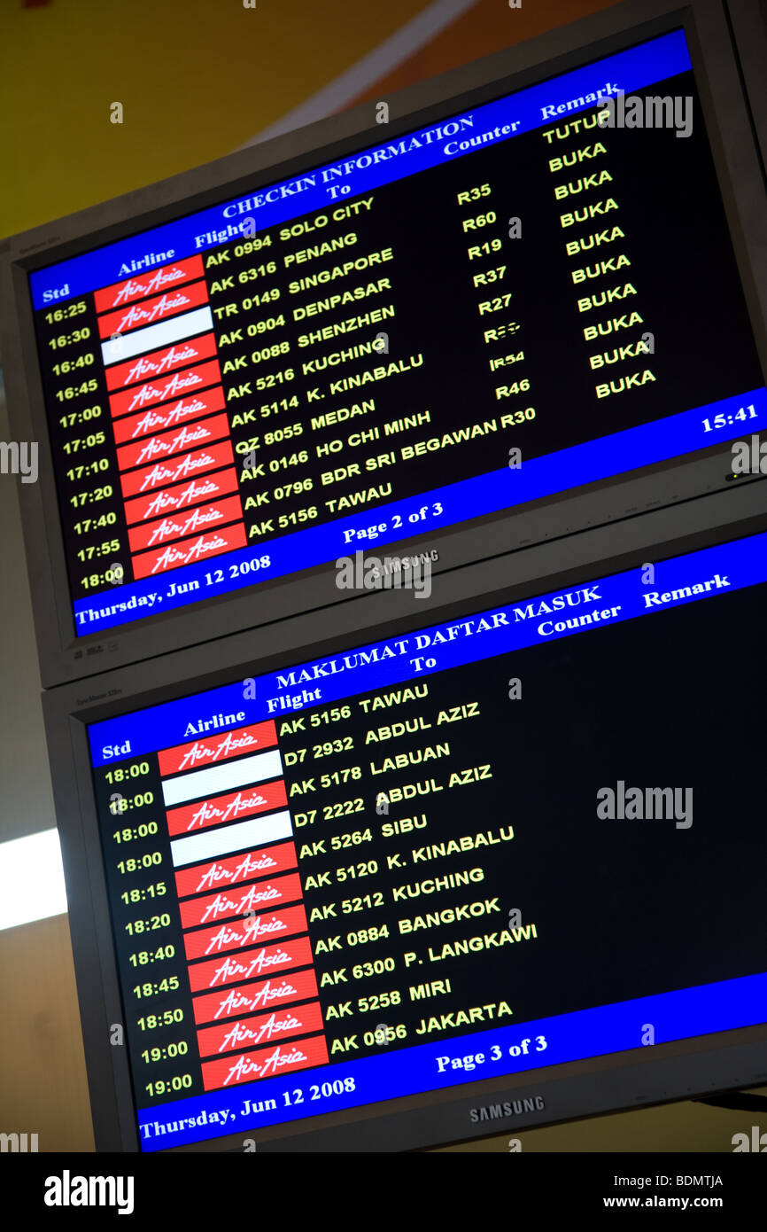 LCC  terminal departure board flight information Stock Photo