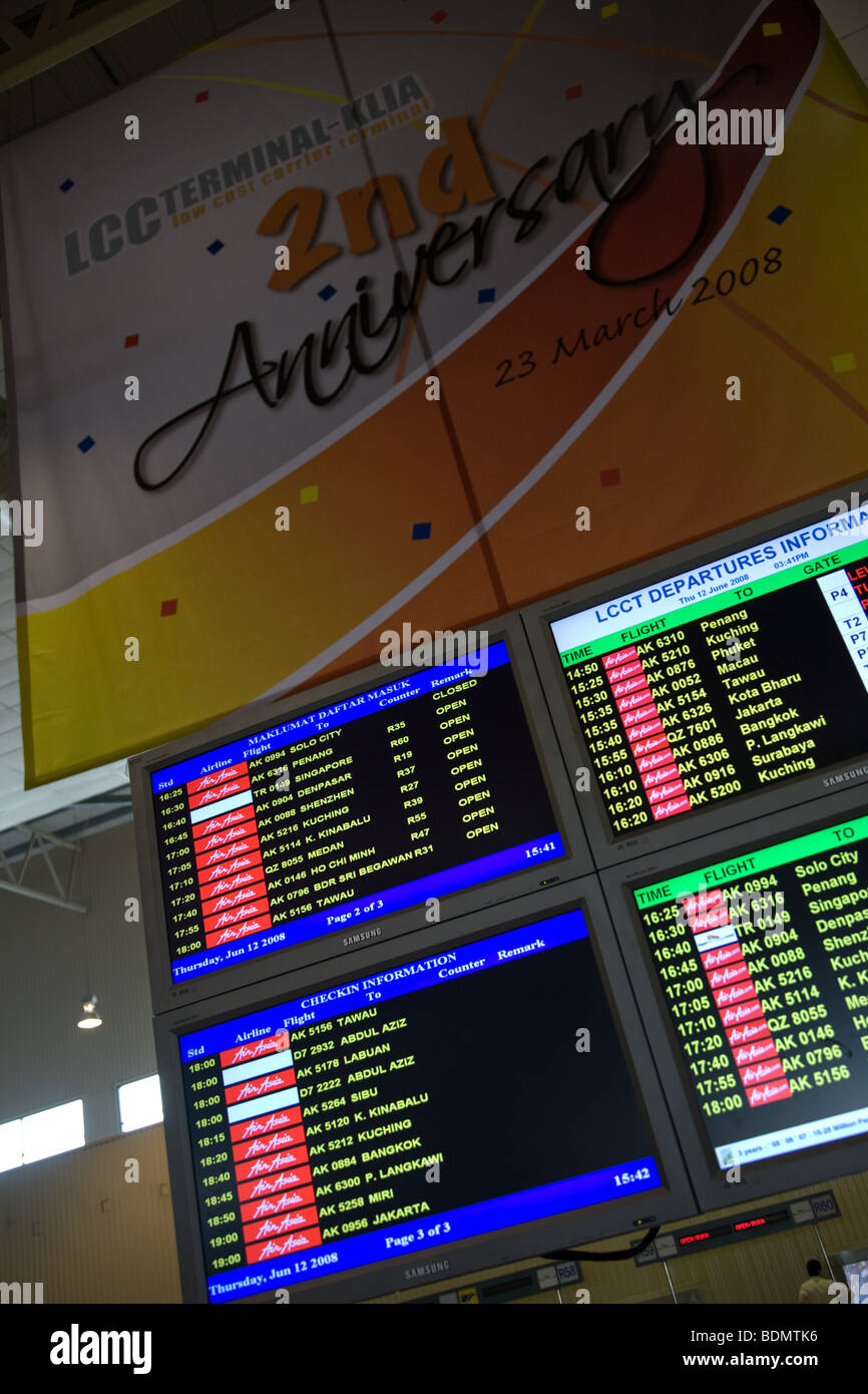 LCC  terminal departure board flight information Stock Photo
