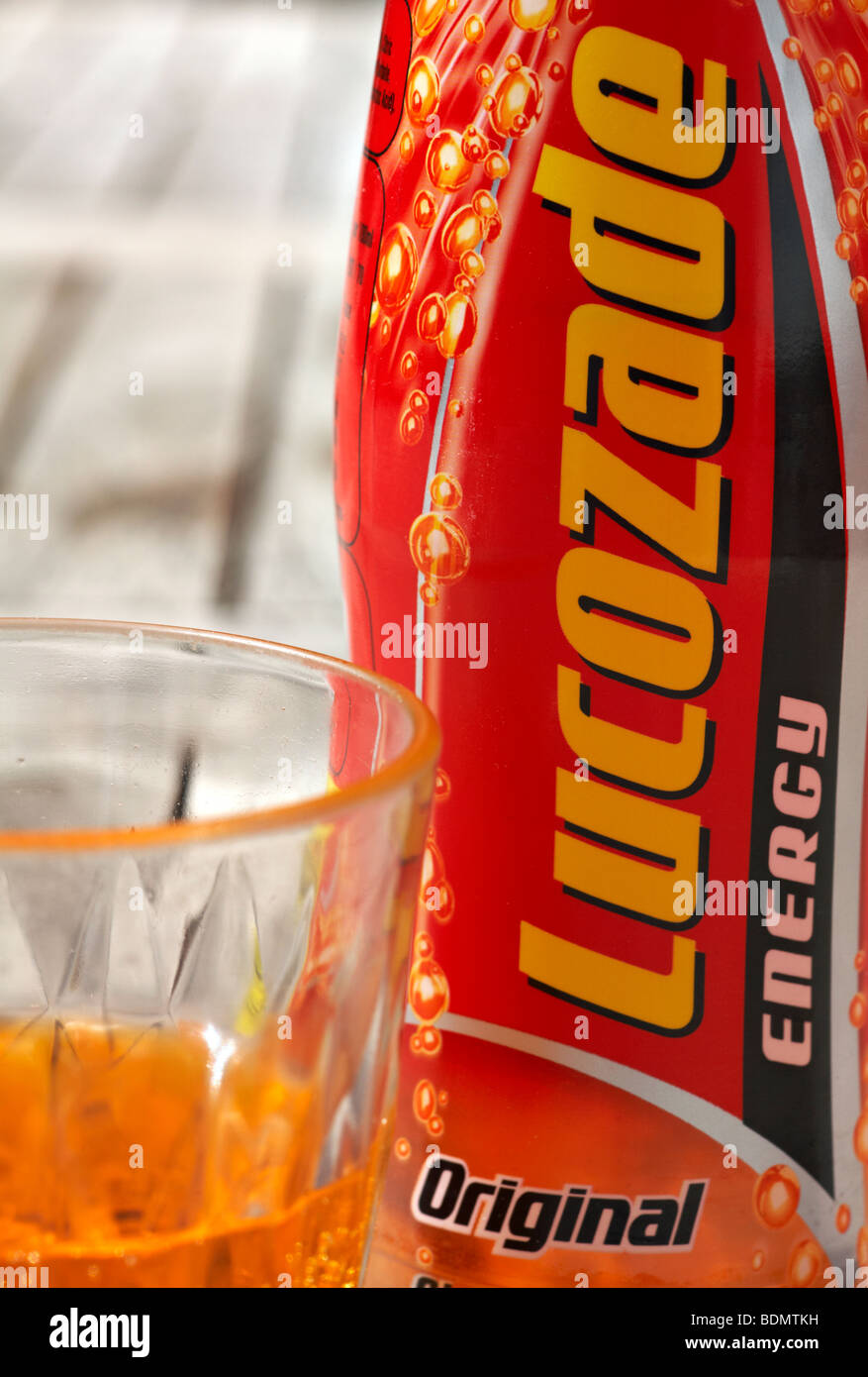 Glass and bottle of original energy Lucozade drink Stock Photo Alamy