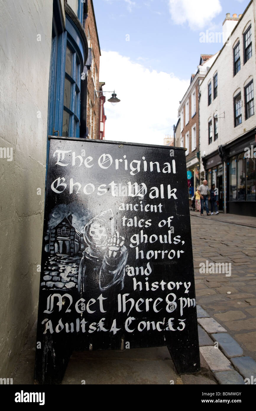 A board advertises the Ghost Walk in the North Yorkshire town of Whitby, England. Stock Photo
