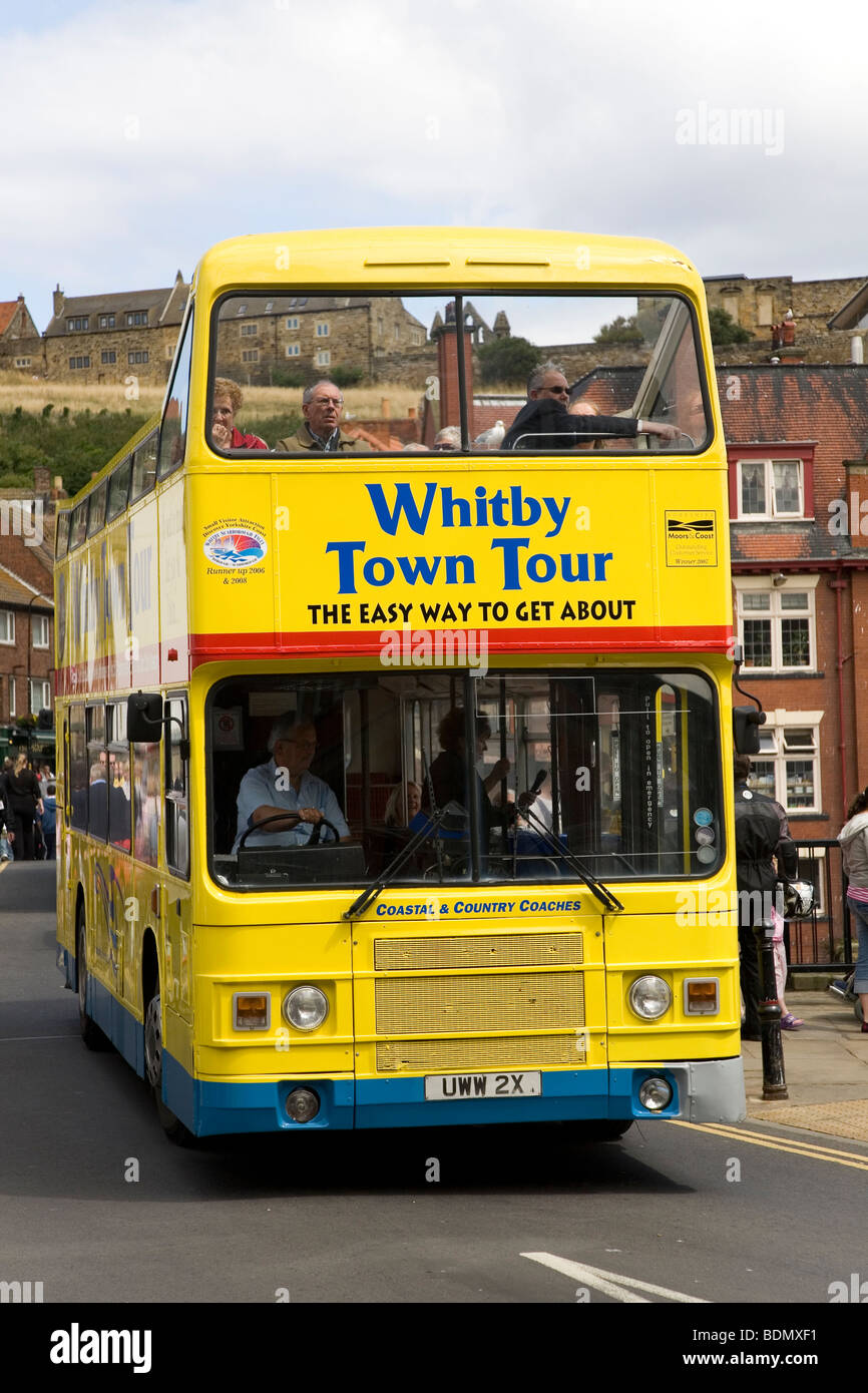 Tourists enjoy a guided bus tour in the North Yorkshire town of Whitby, England. Stock Photo