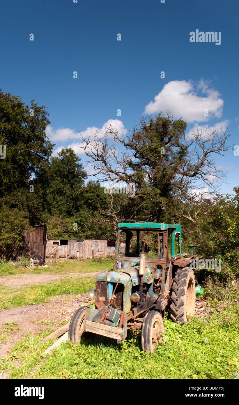 Old tractor lies no longer working at a small farm Sapperton Gloucestershire Cotswolds Stock Photo