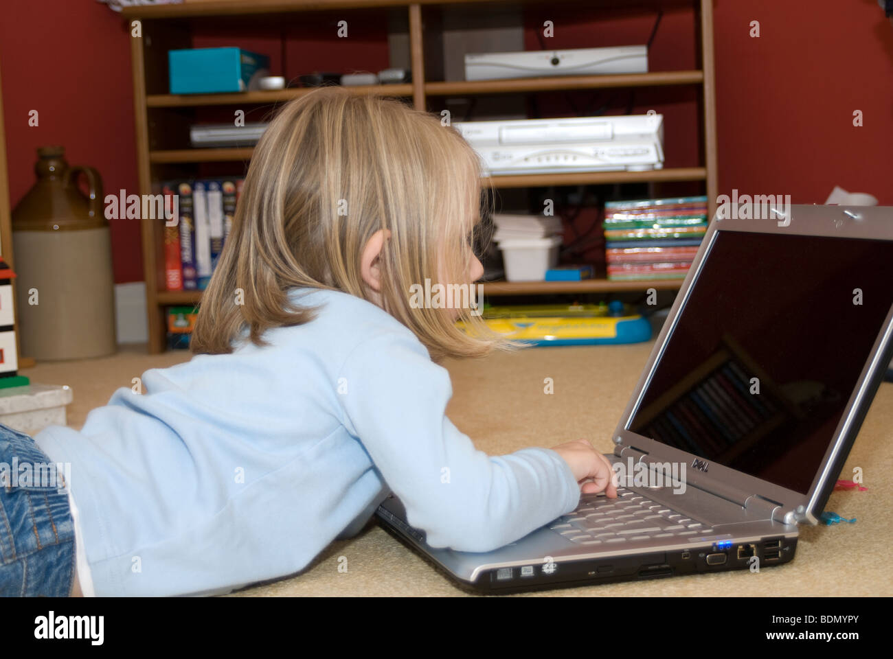Toddler using laptop computer Stock Photo