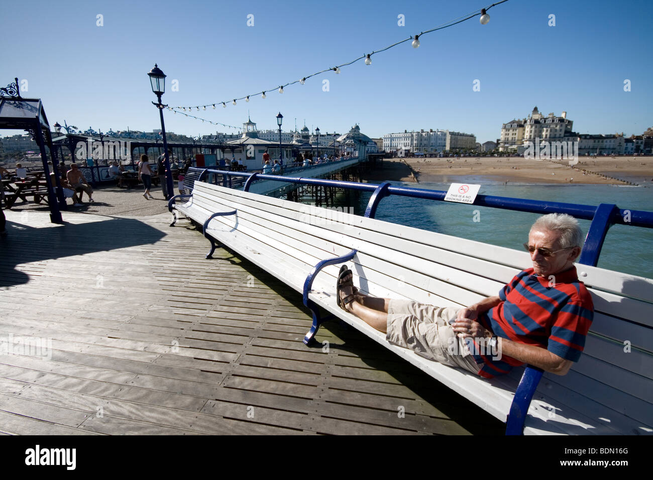 Relaxing on the pier at Eastbourne, England. Stock Photo