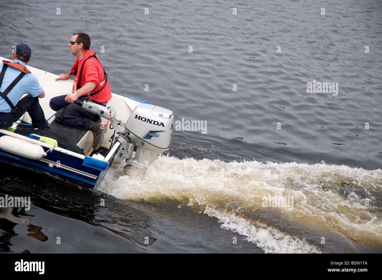 Two men fishing in a boat hi-res stock photography and images - Alamy