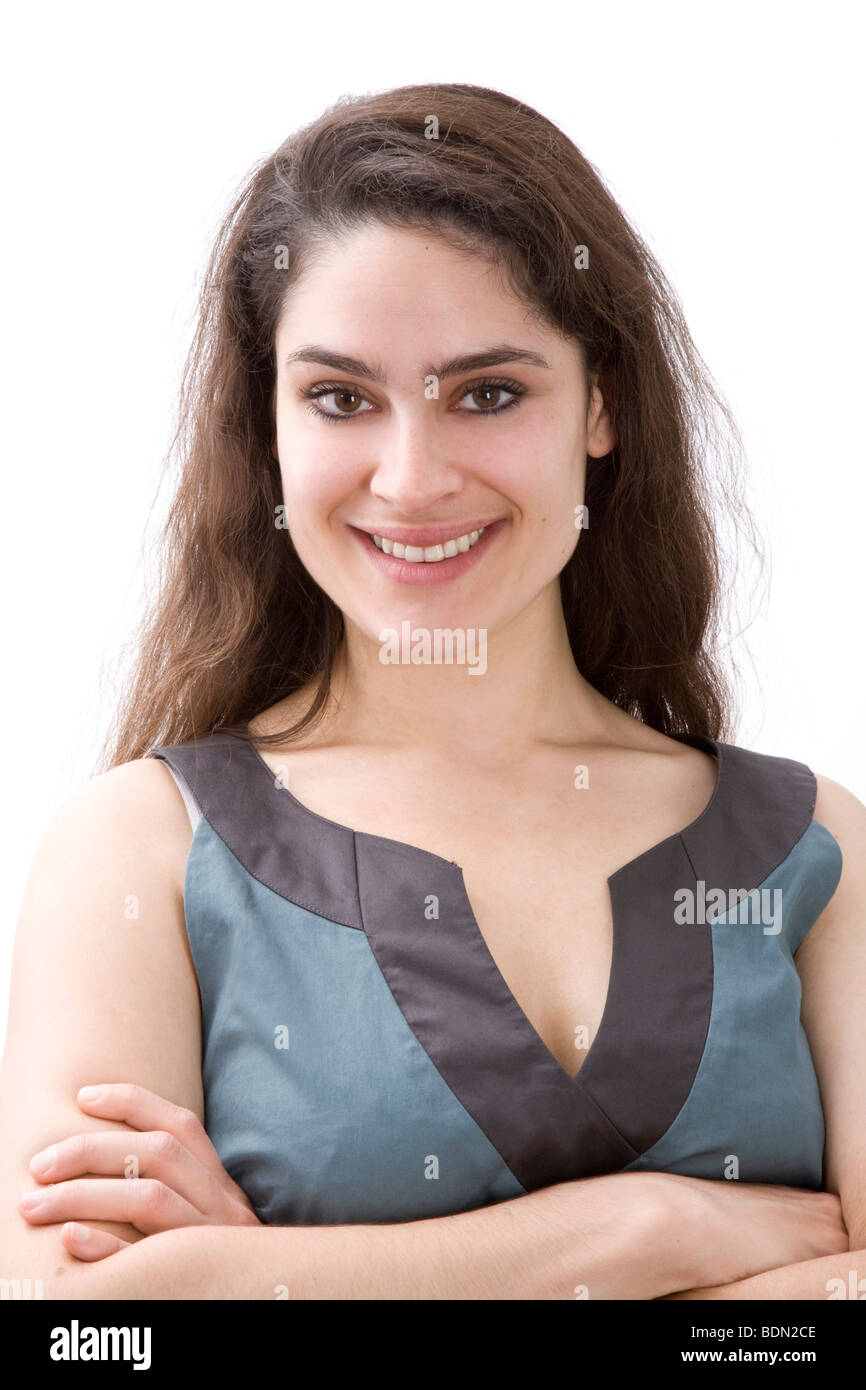 Beaming girl, folded arms Stock Photo