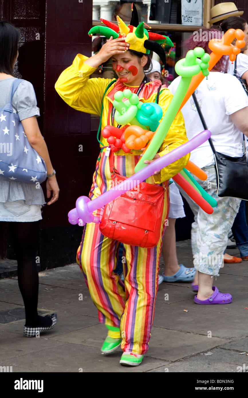 Clown selling balloons at Notting Hill carnival Stock Photo Alamy