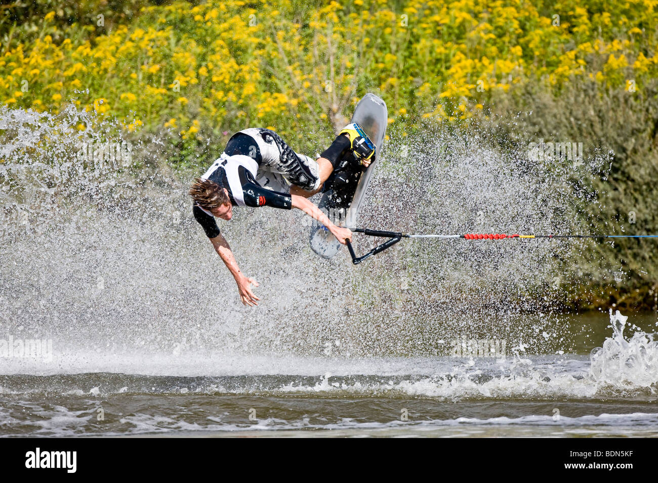 Young man doing waterski tricks at the EAME 2009 championships, Vallensbaek, Denmark, Europe Stock Photo