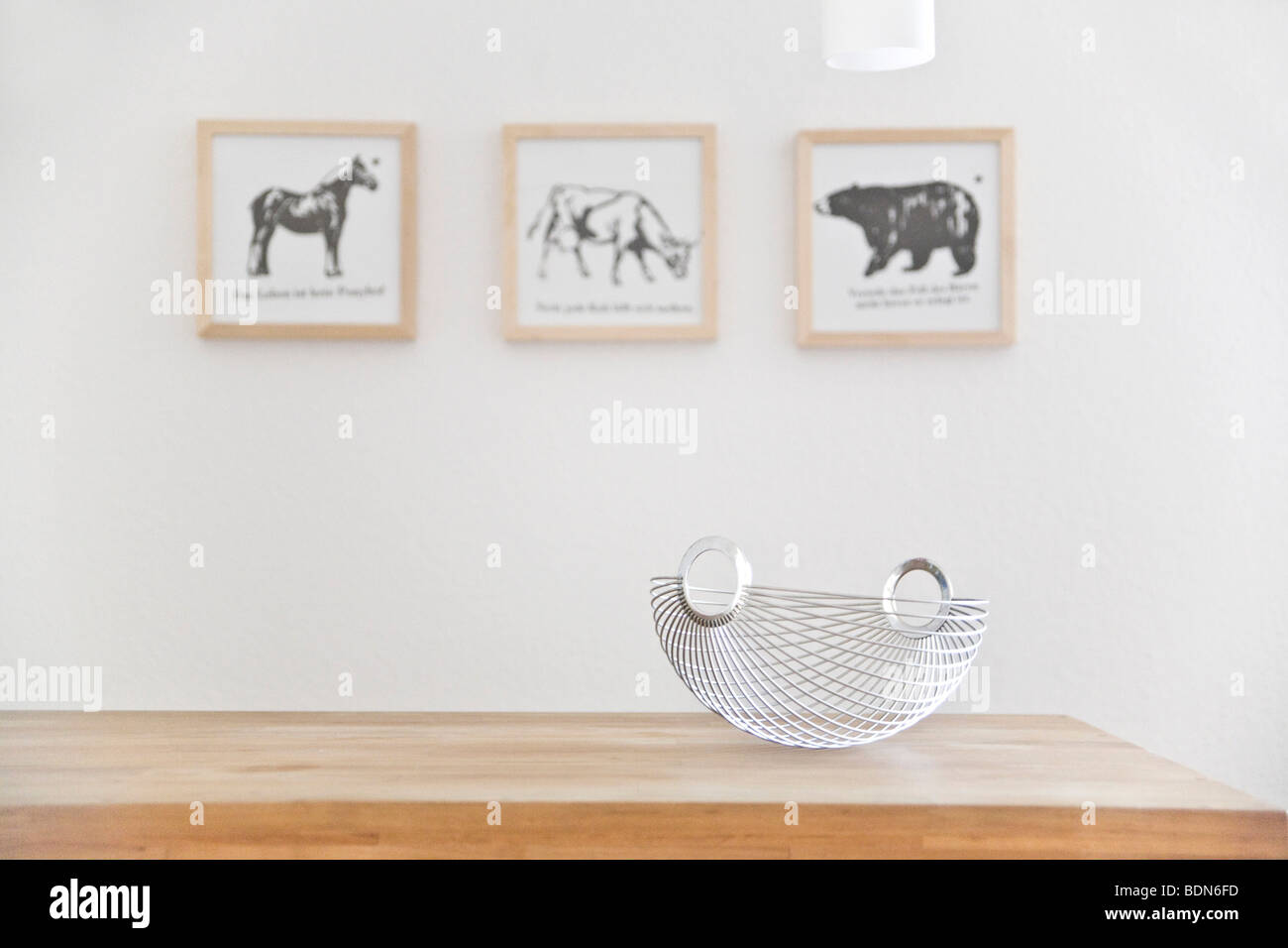 Kitchen counter with bowl and paintings in the back Stock Photo
