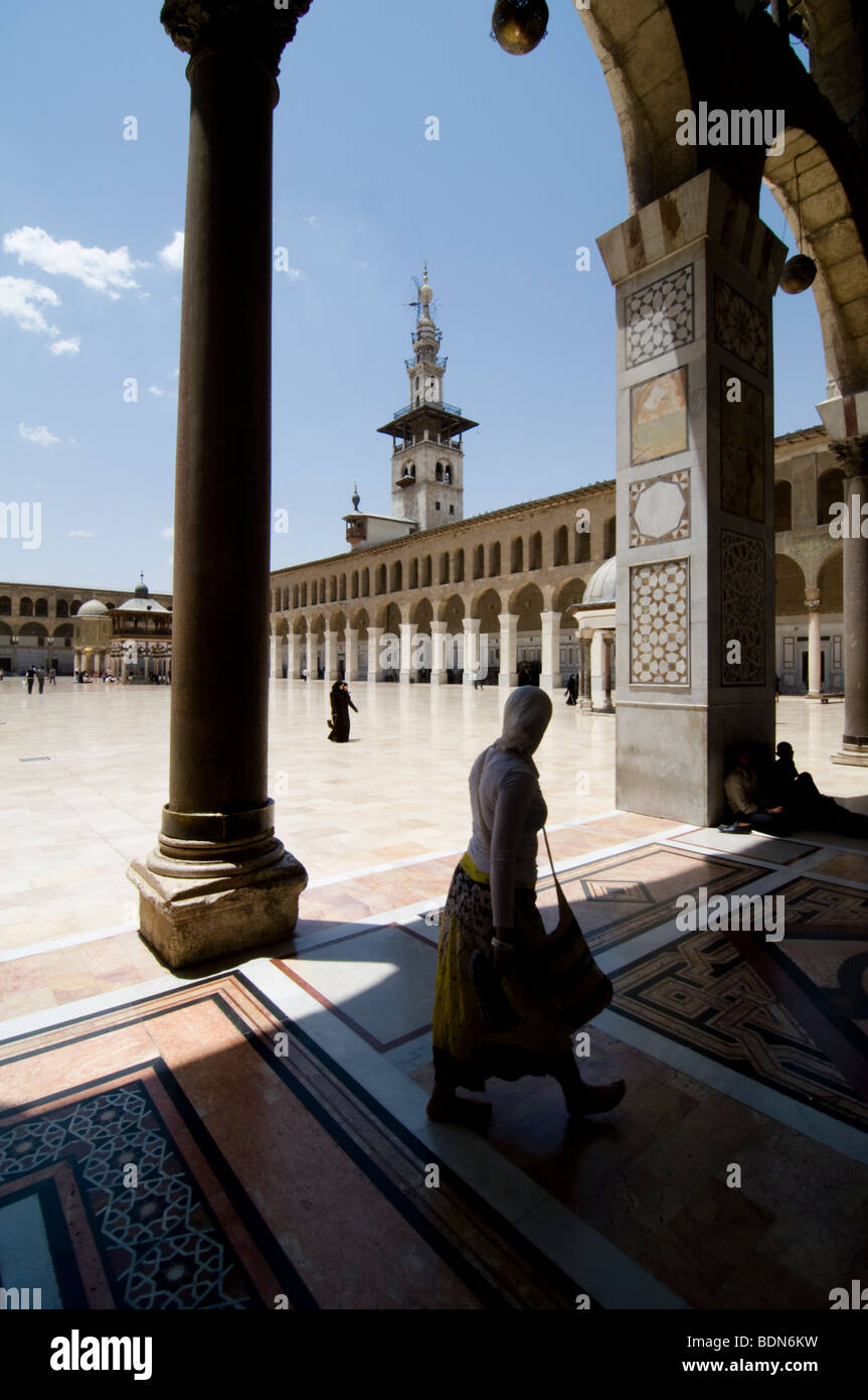 Veiled women walk in the courtyard of the Umayyad Mosque (Grand Mosque of Damascus). Stock Photo