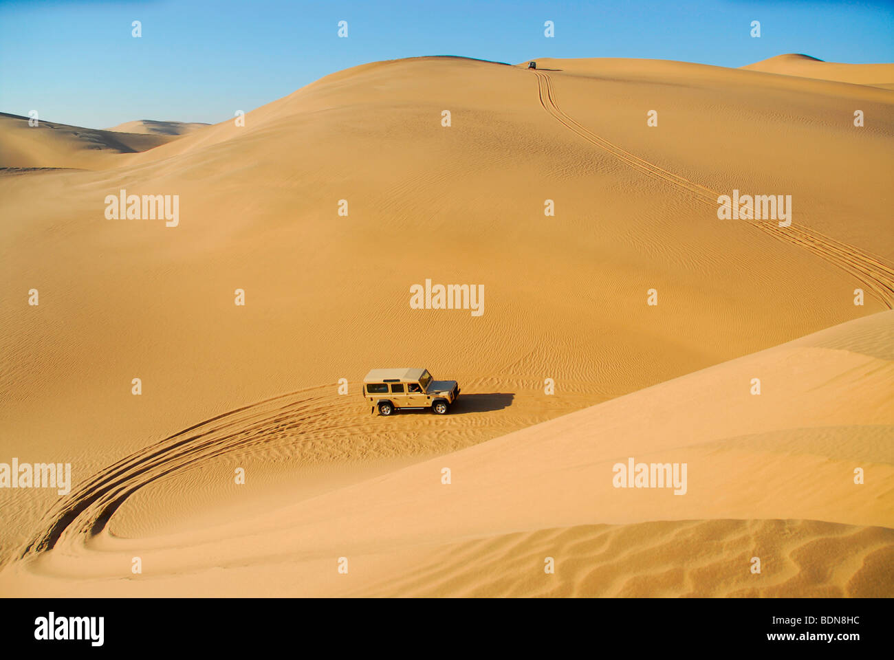 Jeeps in the dunes near Conception Bay, restricted diamond area, Namibia, Africa Stock Photo
