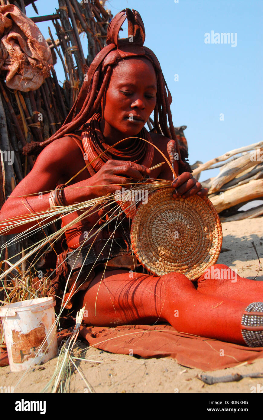 Himba woman making a bast mat, handicrafts, Purros, Kaokoveld, Namibia, Africa Stock Photo